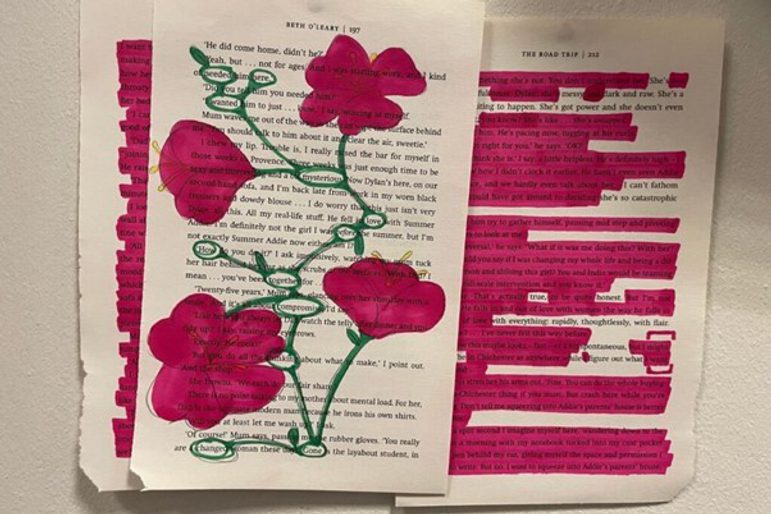 Pieces of paper with poetry and illustrations