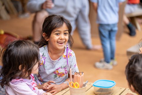 Kids in Children's Tent with colouring pencils
