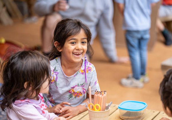 Kids in Children's Tent with colouring pencils