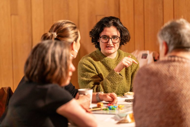Group of people in discussion around a table
