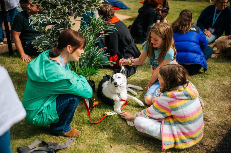 Group on grass with dog