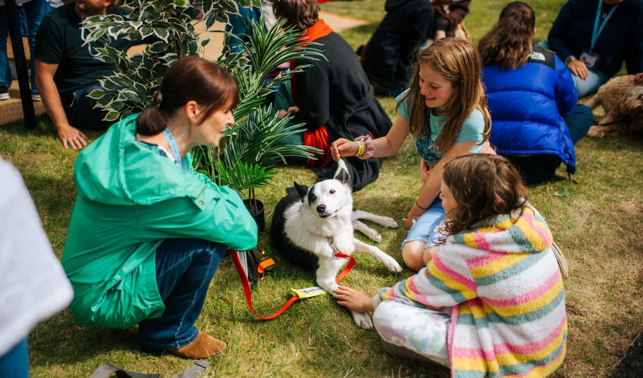 Group on grass with dog