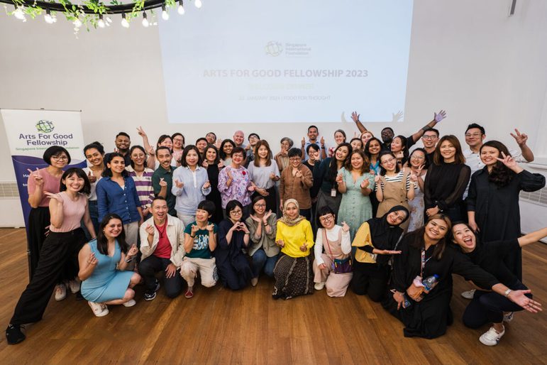 Large group in front of a projected screen