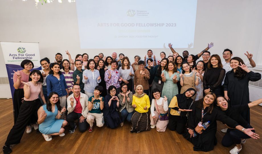 Large group in front of a projected screen