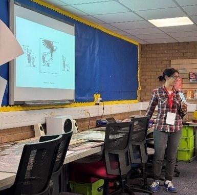 A person standing in front of a projector