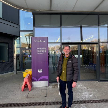 Author Mike Nicholson standing outside Edinburgh Sick Kids