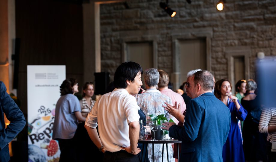 People at a hospitality event chatting and mingling