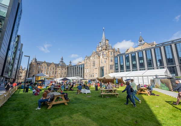 Photo of the Book Festival Courtyard in the sun with lots of people