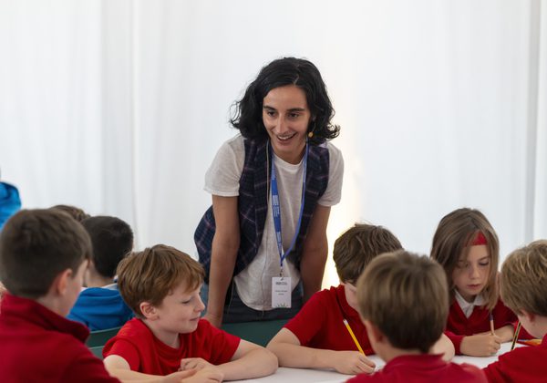 Photo of school kids at a table during the Book Festival