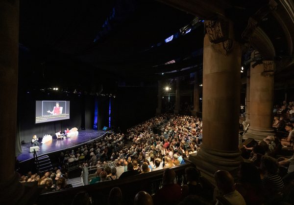 Photo of audience and stage at McEwan Hall