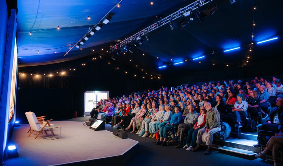 Inside of Courtyard Theatre with stage on left and audience in raked seating on the right