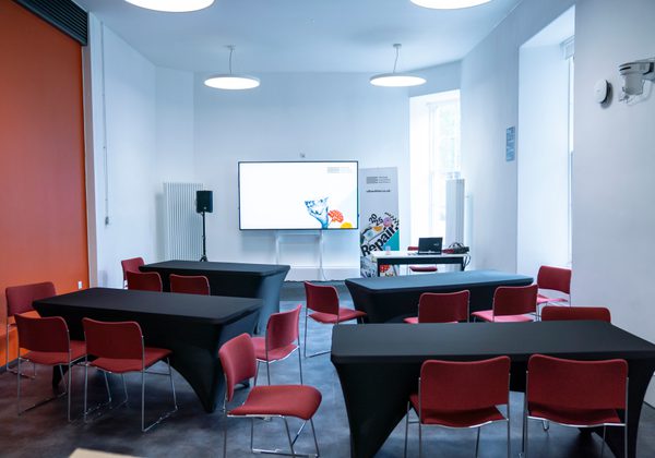 Photo of tables set up in Book Festival workshop space Venue A