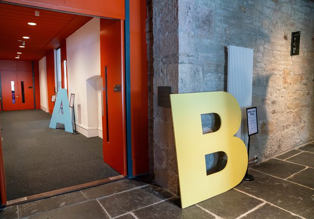 Shows venue B sign in corridor at EFI